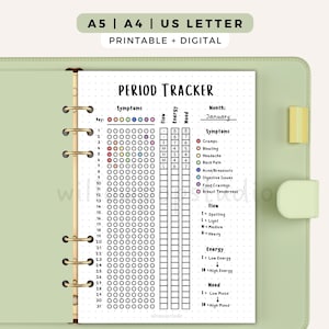 May include: A printable and digital period tracker planner page in a light green binder. The page features a monthly calendar grid for symptoms, flow, energy, and mood tracking, with a key for symptoms including cramps, bloating, headache, and acne.