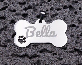 Large stainless steel dog tag personalized with name engraving, paw print, round, 5 cm.