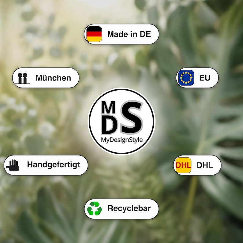 May include: A collection of white and black stickers with text and icons. The stickers include the text "Made in DE", "M&uuml;nchen", "Handgefertigt", "Recyclebar", "EU", and "DHL". The central sticker has the text "MyDesignStyle".