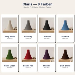 Peut inclure: Pr&eacute;sentation de huit abat-jours coniques de diff&eacute;rentes couleurs : blanc ivoire, gris cendr&eacute;, charbon, bleu ciel, vert herbe, rouge &eacute;carlate, prune et marron fonc&eacute;. Le texte "Claris - 8 Farben" et "Bambu PLA Matte Modern Palette" est affich&eacute;.