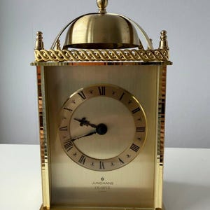 JUNGHANS??? RÉVEIL MUSICAL CALÈCHE LAITON (RÉVEIL) vers 1910