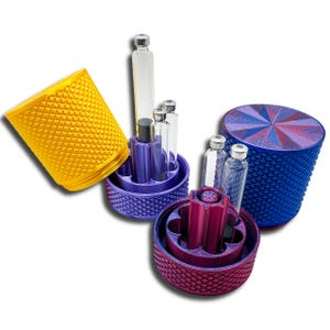 Screw-top GLP-1, peptide, and insulin cartridge containers in multiple colors, shown open with 3ml pen cartridges and center purge tower compartments.