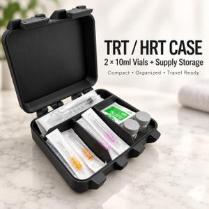 May include: A black, rectangular, hard-shell storage case with a hinged lid, featuring internal compartments containing medical supplies, including syringes, needles, and two small vials. Text reads: TRT / HRT CASE, 2 x 10ml Vials + Supply Storage.