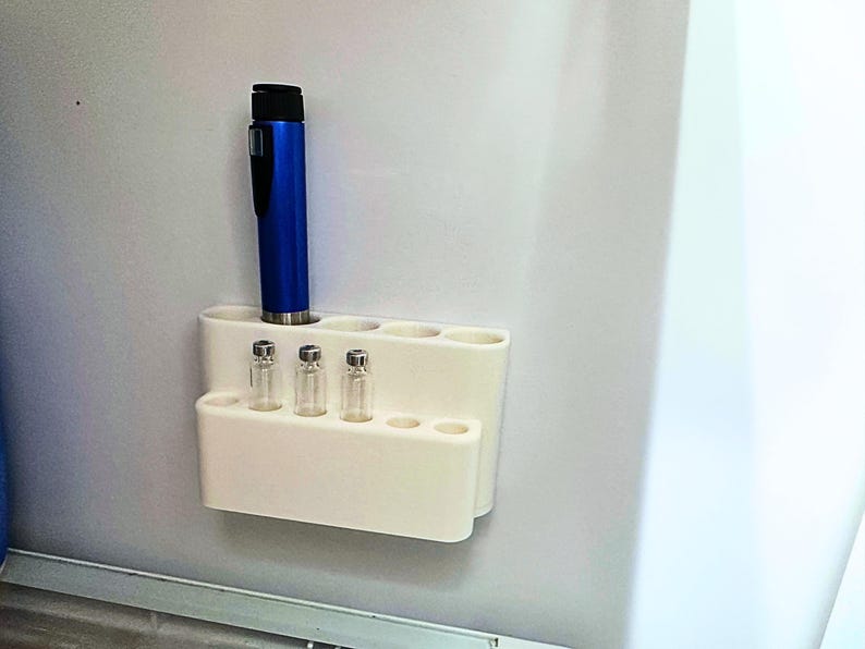 Compact refrigerator organizer for GLP-1 pens and peptide vials, wall mounted insulin pen holder with multiple slots, minimalist fridge storage solution for daily medication routines and easy access