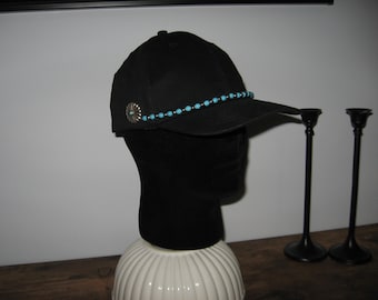 Hats for cancer patients. Hat with turquoise and silver buttons.