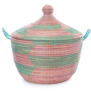 May include: A woven storage basket with a lid, featuring a pink and green striped pattern. The basket has two handles on the sides.