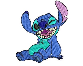 May include: A blue and turquoise cartoon character with a big grin and one eye closed, sitting with its legs crossed. The character has large ears and a pink nose.
