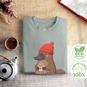 UE | Camiseta fofa de ornitorrinco, camiseta de algodão orgânico com estampa de chapéu e café, presente sustentável para amantes de animais, corte unissex