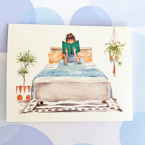 May include: Watercolor illustration of a person reading in bed. The person is wearing a striped shirt and holding a green book. The bed has orange pillows, a blue blanket, and a patterned rug. Plants in pots and hanging baskets are also depicted.