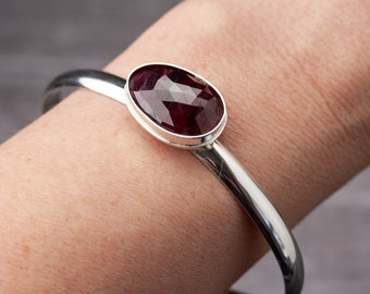 Dark red sapphire cuff bracelet in sterling and fine silver | Thick silver cuff bracelet with faceted red sapphire | MADE TO ORDER