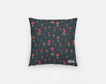 May include: Square cushion featuring a dark teal background adorned with a repeating pattern of pink and yellow mushrooms. The mushrooms have pink caps with white spots and yellow stems. The cushion is square in shape.