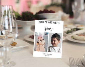May include: A white card with black text that reads "WHEN WE WERE four" with photos of two children, a girl and a boy, in separate frames. The text below the photos reads "Eabha and Matt 23.04.22".