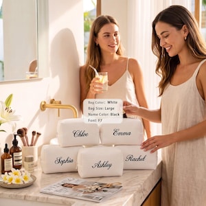 May include: Five large white rectangular toiletry bags with a textured waffle pattern. Each bag features a custom name embroidered in black script font. The names visible are Chloe, Emma, Sophia, Ashley, and Rachel. A small label displays Bag Color: White, Bag Size: Large, Name Color: Black, Font: F7.