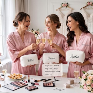 May include: Three individuals wearing dusty rose satin robes with the word Bridesmaid embroidered on the chest. Each holds a white rectangular cosmetic bag with a black embroidered name: Chloe, Emma, or Sophia. Text reads: Bag Color: White, Bag Size: Large, Name Color: Black, Font: F7.