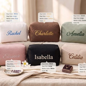 May include: Six large waffle-textured cosmetic bags in white, brown, green, pink, black, and beige. Each bag features a personalized name embroidered in a specific color and font style, with labels indicating bag color, size, name color, and font choice.