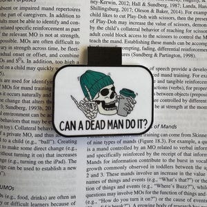 May include: A rectangular sticker with a black border features a skull wearing a green beanie and holding a coffee cup and a hand gesture. The text "CAN A DEAD MAN DO IT?" is displayed.