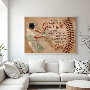 May include: A framed baseball-themed print featuring a baseball player mid-swing, with a baseball and stitching graphic. The text reads "YOUR TALENT IS God's gift TO YOU WHAT YOU DO WITH IT IS YOUR GIFT BACK TO God" in a rustic font.