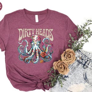 a purple shirt with an octopus on it