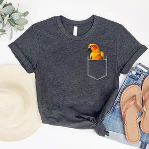 Pocket Parrot Shirt – Cute Sun Conure Lover T-Shirt – Funny Bird in Pocket Tee – Parrot Owner Gift – Bright Colorful Pet Bird Top