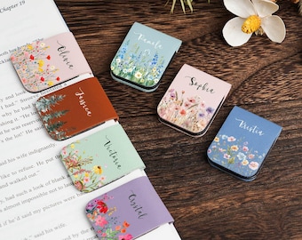May include: Personalised magnetic bookmarks with floral patterns and names such as Olivia, Jessica, and Kristia. Each bookmark has a unique colour scheme and flower arrangement, ideal for marking pages in a book.