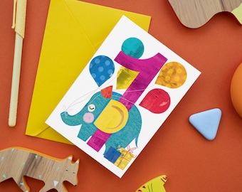 May include: A colorful birthday card featuring a blue elephant holding balloons and a number one. The elephant has a yellow ear and a pink nose. The card has a white background and is decorated with colorful confetti.