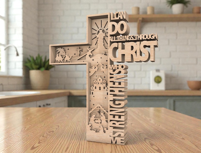 May include: A wooden cross with the words "I CAN DO ALL THINGS THROUGH CHRIST WHO STRENGTHENS ME." The cross features cut-out images of religious scenes, including a nativity scene and a figure with outstretched arms.