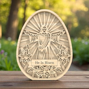 May include: A white ceramic mug with a black handle and the text "But First, Coffee" in a bold, black font. The mug is set against a blurred background, suggesting a cosy setting.