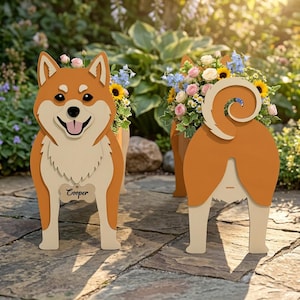 May include: Wooden dog-shaped planter with a smiling face and a curled tail. The planter is painted in shades of brown and cream, with the name "Cooper" on a tag. The planter is filled with colorful flowers, including sunflowers and roses.