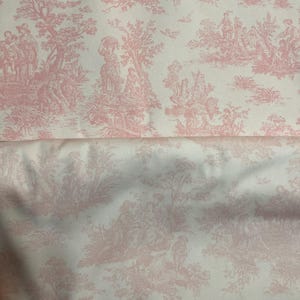 May include: Pink and white toile fabric featuring a pastoral scene with figures, trees, and architectural elements. The fabric has a detailed, repeating pattern, suitable for various sewing and crafting projects.
