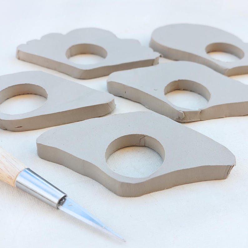 Beginner ceramics project smoothing book page holder edges, DIY pottery with printable template