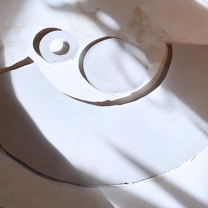 Clay slabs on sunlit worktable, showing bowl bases and template cut-outs in progress. Perfect inspiration for ceramic template users.