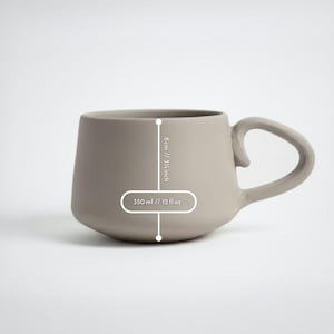 Finished handbuilt round mug with measurements, created using printable pottery template, perfect for beginner ceramics, pottery tool for modern kitchen decor.