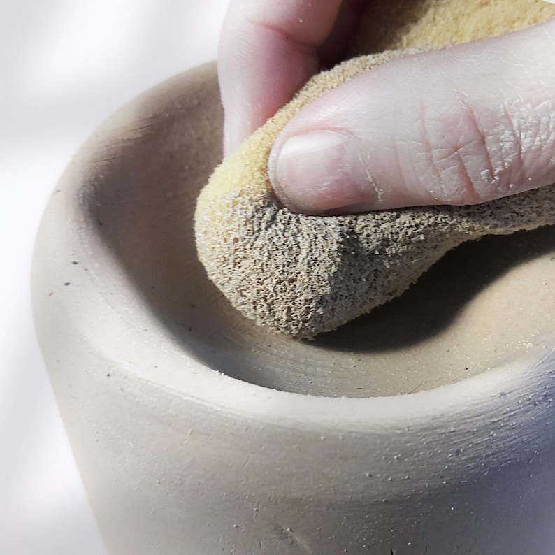 Shaping the top of handmade pottery oil burner using a sponge, slab pottery technique