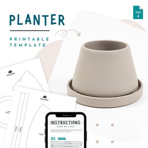 May include: A beige ceramic planter with a matching saucer, alongside printable templates and instructions. The word "PLANTER" is displayed in teal, with "PRINTABLE TEMPLATE" below. A smartphone displays step-by-step instructions.