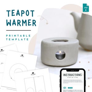 Puede incluir: Un calentador de tetera de hormigón gris con un diseño circular y una abertura lateral para una vela de té. La imagen también muestra una tetera blanca, plantillas imprimibles y un teléfono inteligente con instrucciones.