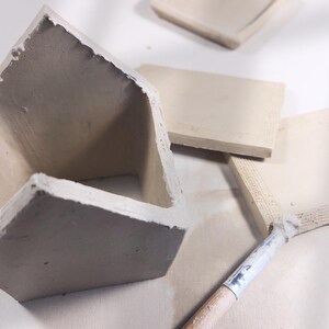 Preparing ceramic roof pieces for slab-built house | pottery tealight project with template-based clay elements