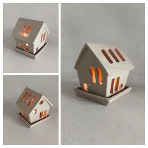 Ceramic tealight houses made with printable slab pottery template | handmade clay lantern with glowing windows | pottery craft project