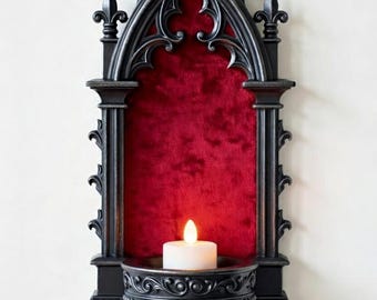 May include: Black gothic-style wall sconce with a red velvet backing, holding a lit white candle. The sconce has ornate detailing and a fleur-de-lis design. The image includes a red circle with the text "it's NOT physical item No Shipping".