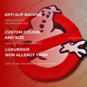 May include: A red, white, and black rug in the shape of the Ghostbusters logo. The rug has a plush texture and features the text "ANTI-SLIP BACKING", "CUSTOM COLORS AND SIZE", "LUXURIOUS NON ALLERGY YARN". The brand name "Rugslana" is also visible.