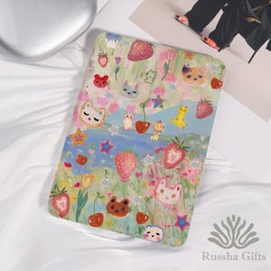 May include: A rectangular, colorful case featuring a whimsical design with strawberries, flowers, stars, and cartoon animal faces. The case has a light green, blue, and pink background. The brand name "Russha Gifts" is visible in the bottom right corner.