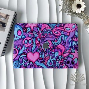 May include: A laptop case featuring a vibrant, colorful design with skulls, stars, and a heart in shades of pink, purple, and blue. The case has an Apple logo cutout and a glossy finish. The overall theme is a bold, artistic design.