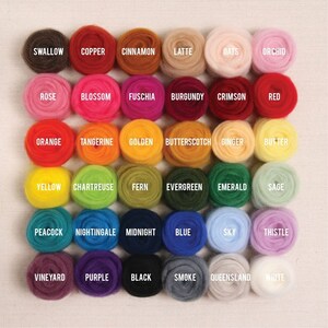 May include: A color chart of 36 different shades of wool yarn, arranged in rows of six. The colors include shades of red, orange, yellow, green, blue, purple, brown, and white.