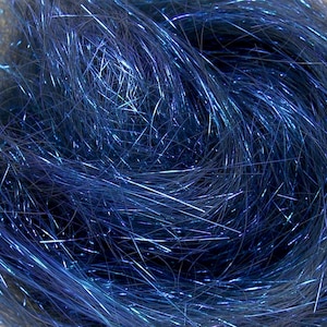 May include: Close-up of a pile of blue tinsel strands. The tinsel has a metallic sheen, with highlights of silver and blue. The strands are intertwined, creating a textured, shimmering effect. This material is often used for craft projects and decorations.