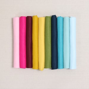 May include: Ten rolls of felt in various colors, including pink, red, burgundy, yellow, gold, green, blue, and light blue.