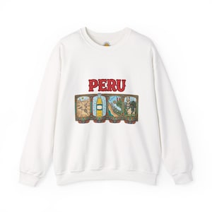 May include: White sweatshirt with the word "PERU" in red letters above a rectangular graphic. The graphic features four framed images with Peruvian themes in shades of brown, blue, and green.