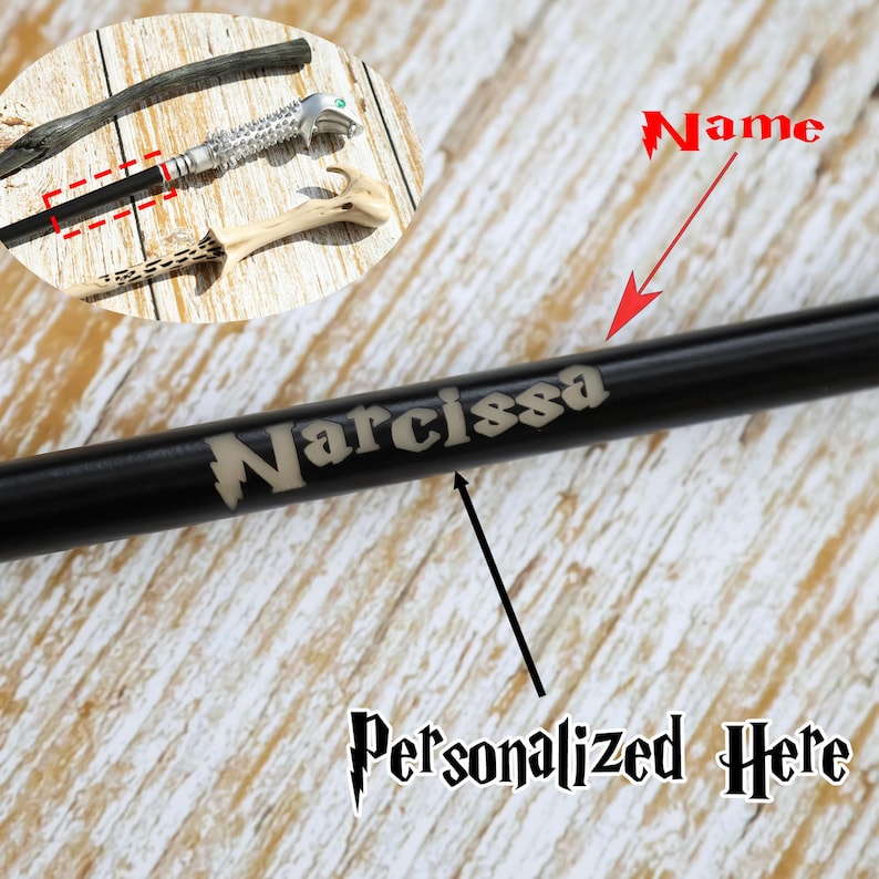 May include: Black wand with the name "Narcissa" engraved in a light color. The wand is personalized with the text "Personalized Here" below the name. Other wands are visible in the background.