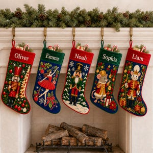 May include: Five personalized Christmas stockings hanging in a row, each featuring a unique embroidered scene including a nutcracker, a ballerina, a mouse, and festive holiday motifs. The names Oliver, Emma, Noah, Sophia, and Liam are stitched on top.