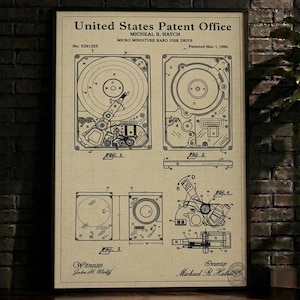 May include: A framed patent print of a micro miniature hard disk drive, dated March 1, 1904. The beige print features detailed technical drawings and the text "United States Patent Office" and "MICHEAL B. HATCH".