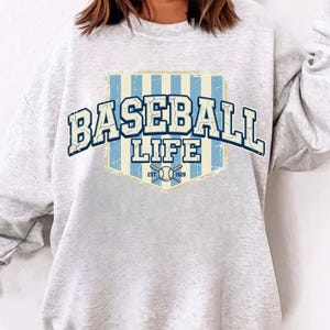 May include: A rustic wooden sign with the text "Welcome to our home" in white lettering. The sign features a distressed finish and a simple, inviting design, perfect for entryway decor.