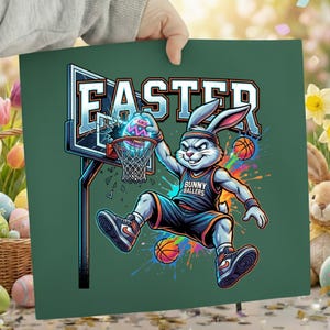 May include: A green square print with a cartoon bunny playing basketball with an Easter egg. The word "EASTER" is above the bunny. The bunny is wearing a basketball uniform that says "BUNNY BALLERS".